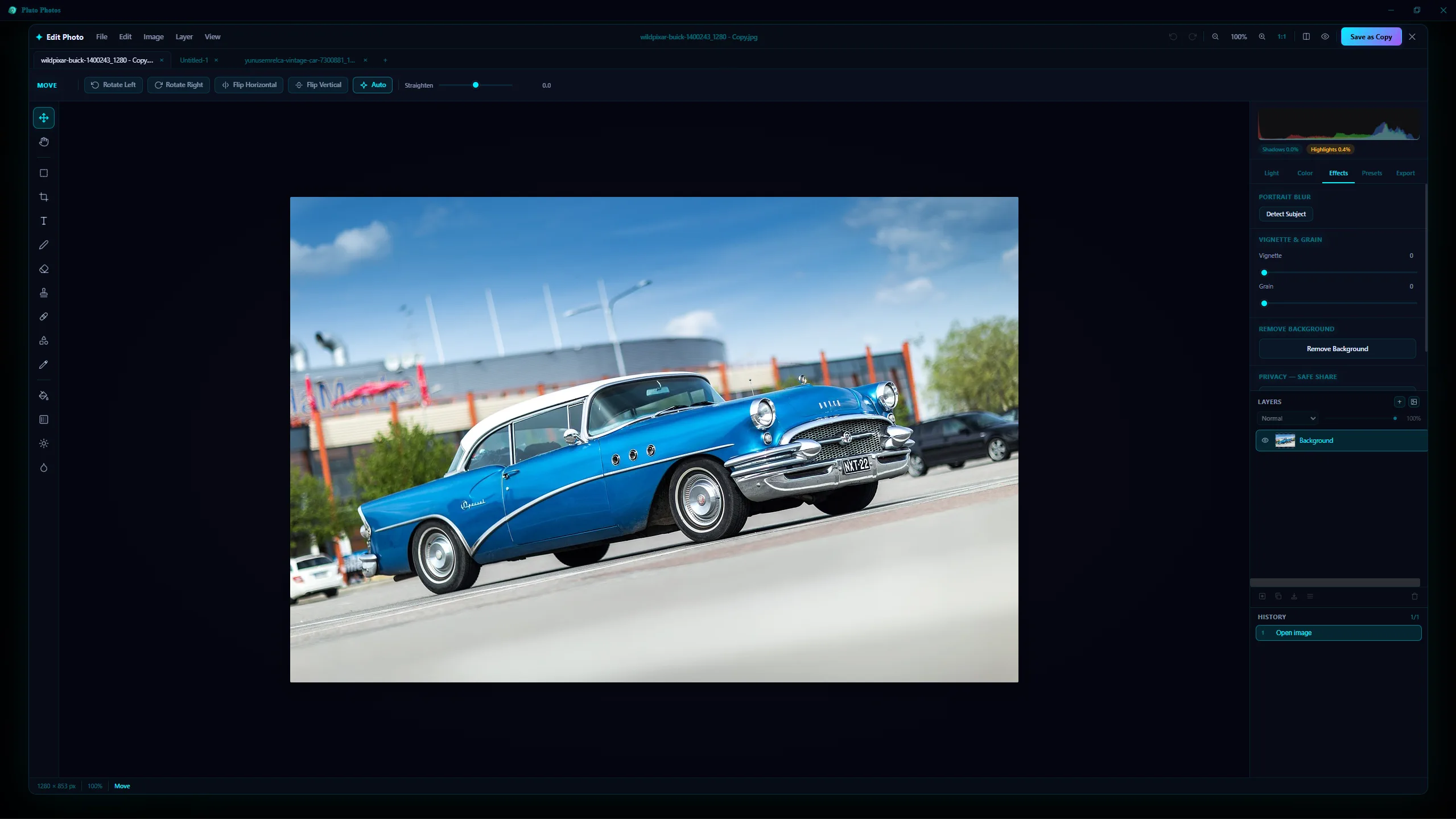 A photo of a blue classic car open in the Pluto Photos image editor