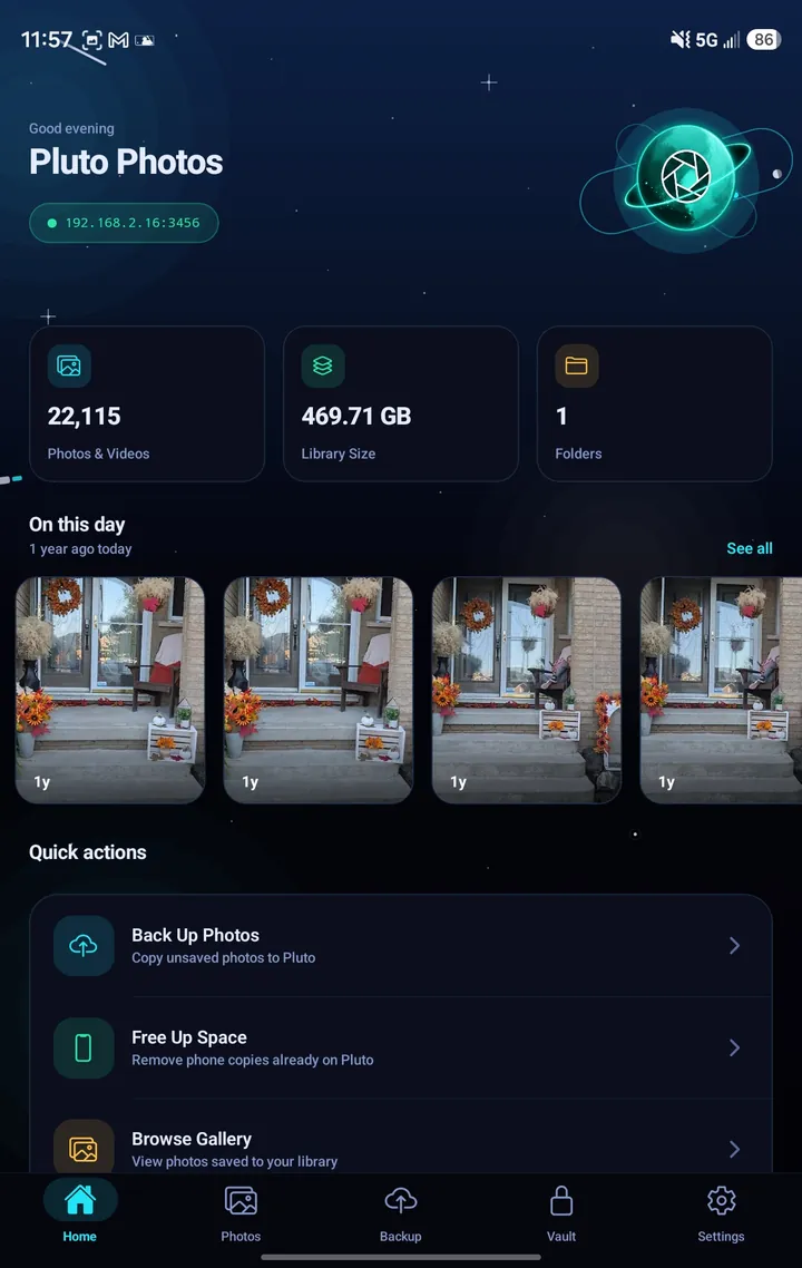 Pluto Companion's Home screen in the Cyber theme: a planet logo, the connected computer's address, library totals of 22,115 photos and videos, an On This Day row of memories, and quick actions for backup, free up space and browsing
